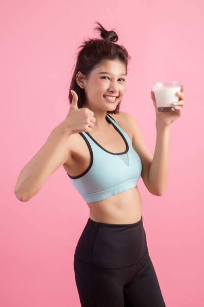 beautiful sport woman drinking milk