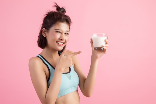 beautiful sport woman drinking milk