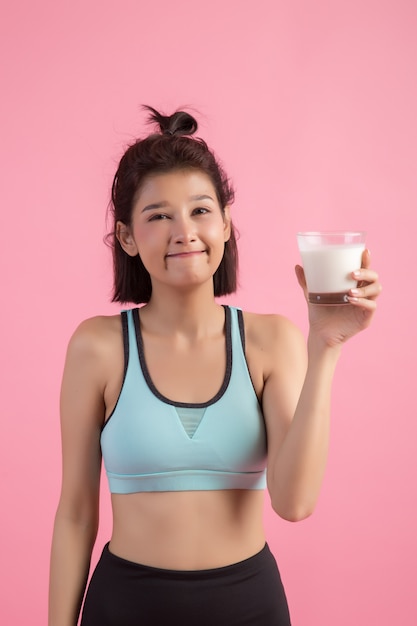 beautiful sport woman drinking milk