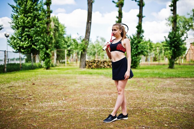 Beautiful sport woman tennis player with racket in sportswear costume