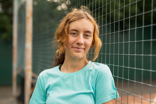 Beautiful sportive woman looking at camera