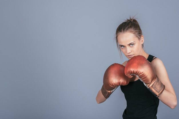 Beautiful sports girl with boxing gloves