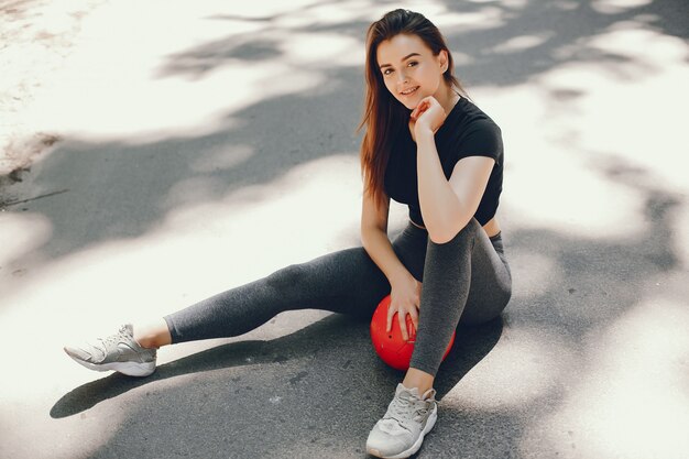 Free Photo beautiful sportsgirl in a summer sunny park