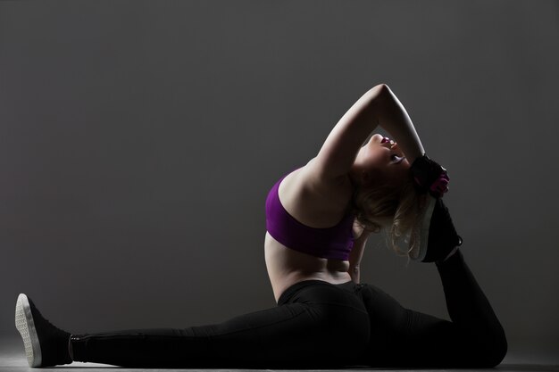 Beautiful sporty girl stretching workout