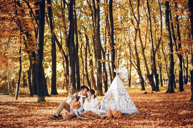 Beautiful and stylish family in a park