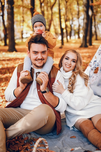 Beautiful and stylish family in a park