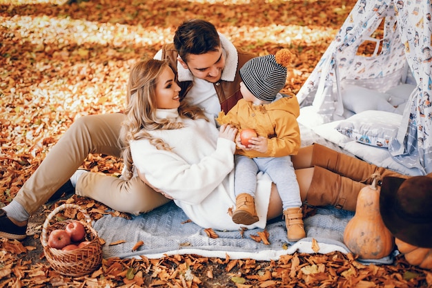 Beautiful and stylish family in a park