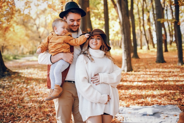 Beautiful and stylish family in a park