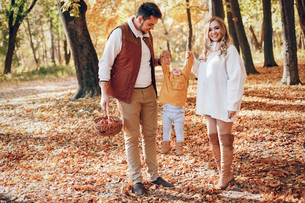 Beautiful and stylish family in a park