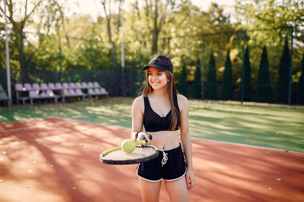 Beautiful and stylish girl on the tennis court