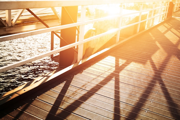 Free photo beautiful sunset in port city. bridge with sea background. horizontal. nature background. urban.