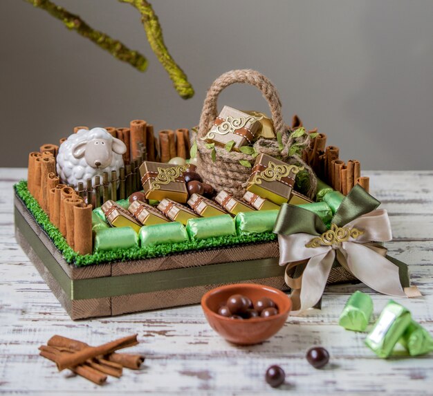 Beautiful sweet and chocolate basket on the table