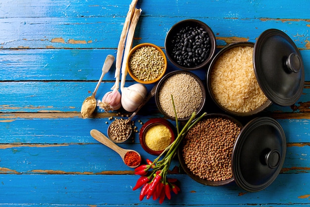 Beautiful Tasty Appetizing Ingredients Spices Grocery for Cooking Healthy Kitchen. Blue Old Wooden Background Top View. 