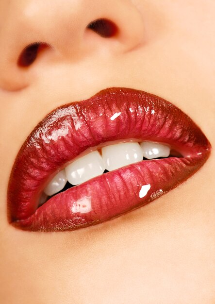 Beautiful teen lips. Gloss lipstick. Healthy leather.