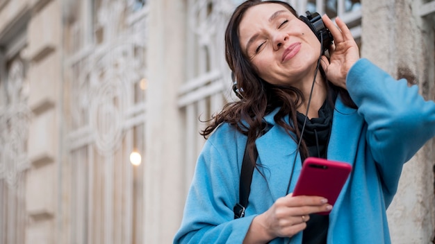 Beautiful teenager listening to music