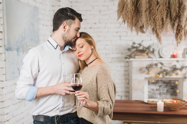 Beautiful tender couple with wineglasses