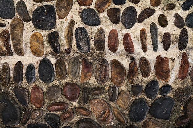 Free photo beautiful texture cobbles or paving stone. top view. horizontal. free space for text.