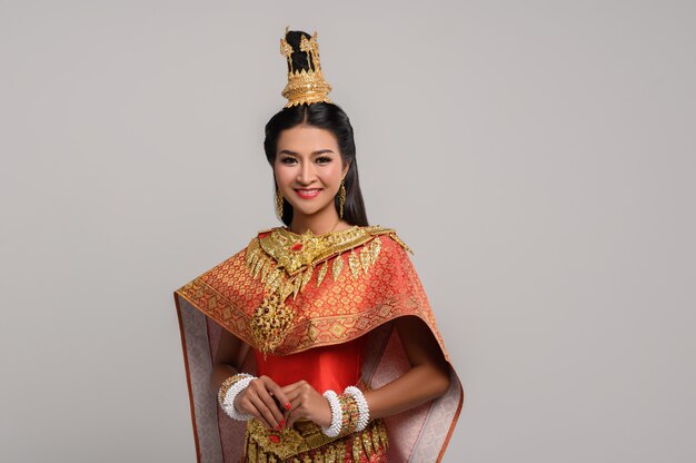 Beautiful Thai woman wearing a Thai dress and a happy smile.