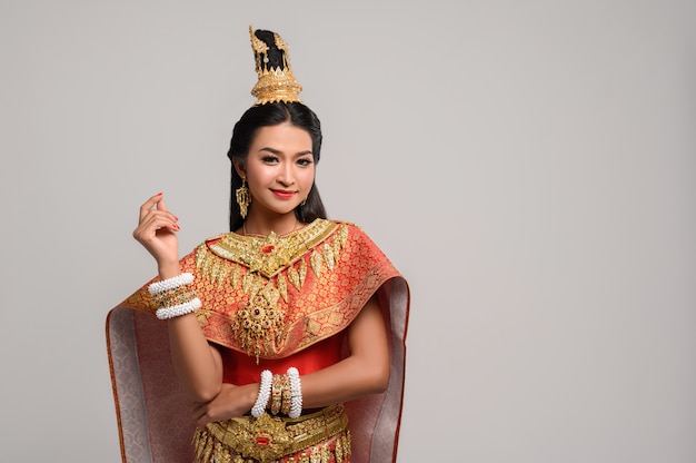 Beautiful Thai woman wearing a Thai dress and a happy smile.