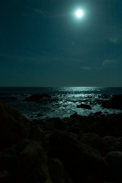 Beautiful tropical beach with full moon in night skies