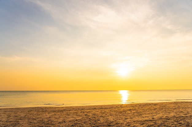 Beautiful tropical nature beach sea ocean at sunset or sunrise