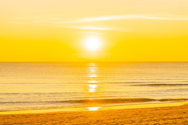 Beautiful tropical nature beach sea ocean at sunset or sunrise
