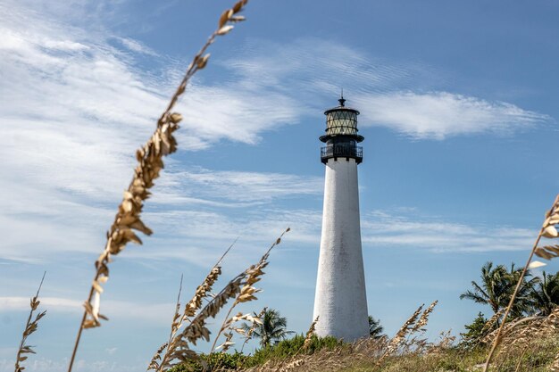 Beautiful view of the Cape Florida Lighthouse with the background of a blue sunny sky