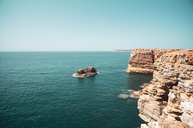 Beautiful view of the cliffs and the sea under the blue sky