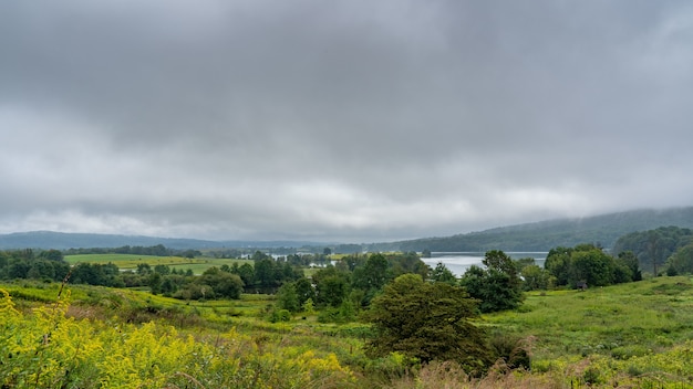 Beautiful view of a landscape with greenery under a cloudy sky