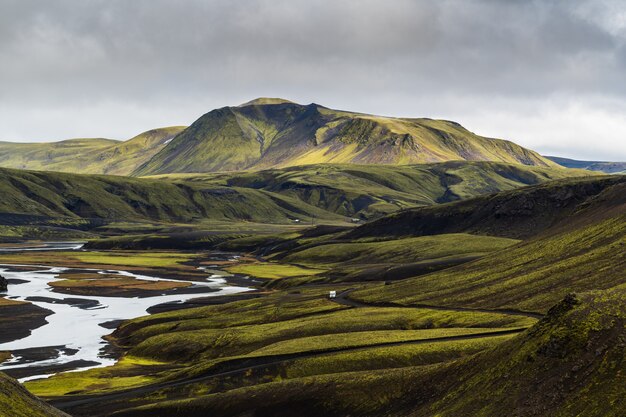 Beautiful view of a mountain in Highlands region of Iceland with a cloudy gray sky