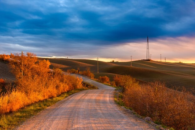 Beautiful view of a road in the Tuscan countryside during the autumn season