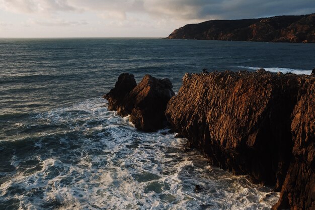 Beautiful view of rocks  at sunset with the ocean in the background