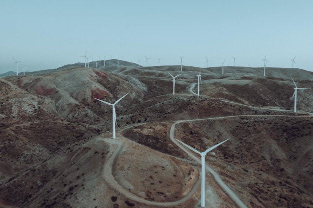 Beautiful view of white windmills on bare mountains