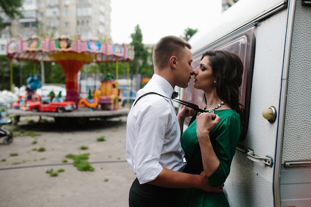 Beautiful wedding couple in each other&#39;s arms in the park