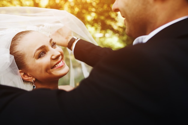 Beautiful wedding couple posing in forest