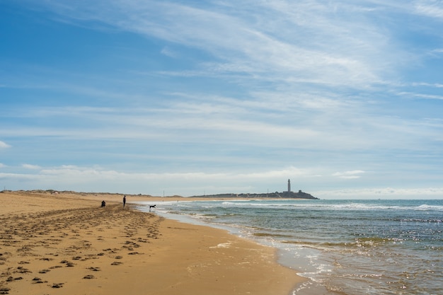 Beautiful wide shot of a sandy beach in zahora spain with a clear blue sky