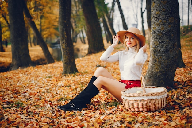 Beautiful woman in a autumn park