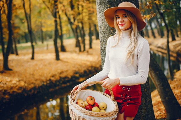 Beautiful woman in a autumn park