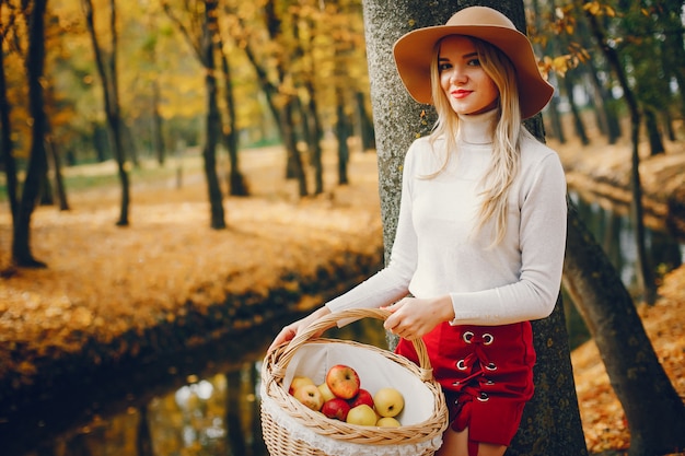 Beautiful woman in a autumn park