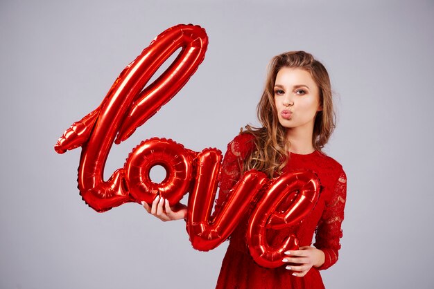 Beautiful woman blowing a kiss