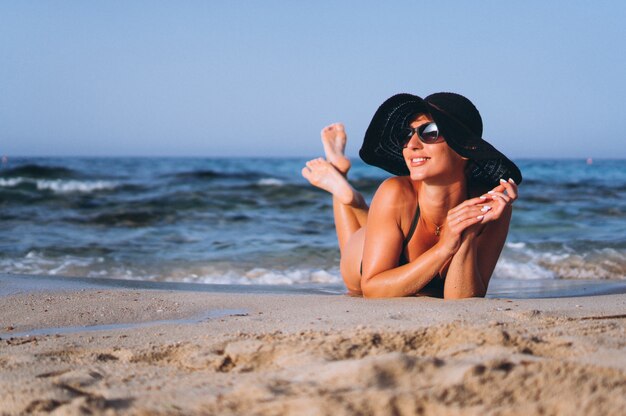 Beautiful woman by the ocean