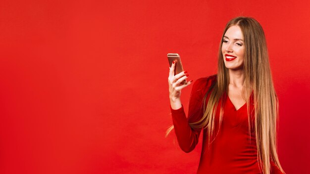 Beautiful woman checking her phone