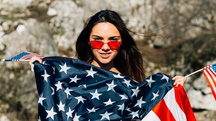 Free Photo beautiful woman covered with american flag