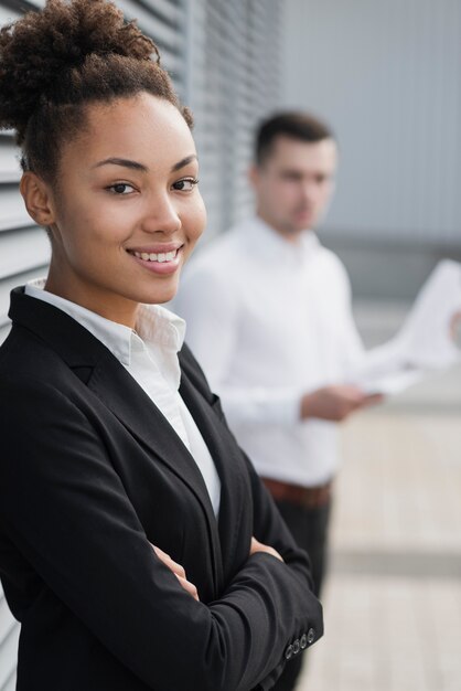 Beautiful woman next to defocused man