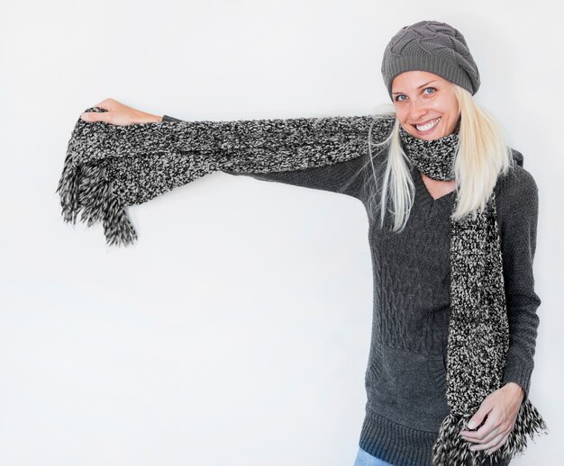 Beautiful woman demonstrating warm scarf