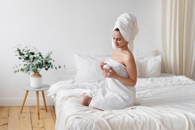 Beautiful woman doing a self care treatment at home