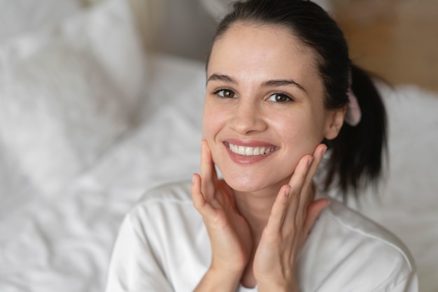 Beautiful woman doing a self care treatment indoors