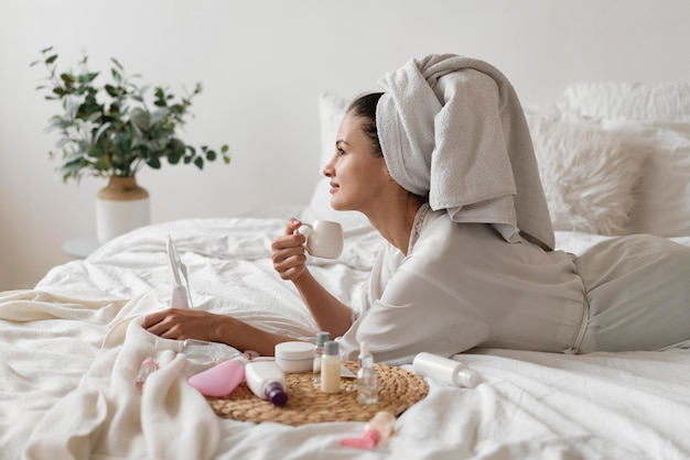 Free Photo beautiful woman doing a self care treatment indoors