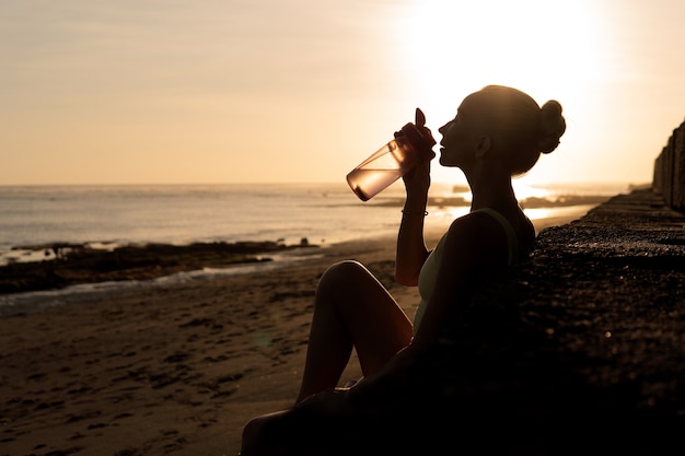 Beautiful woman drinking water. bali