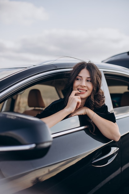 Beautiful woman driver travelling